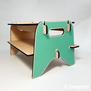 May include: A teal blue and natural wood two-tiered shelf with a handle. The shelf is made of plywood and has a modern design.