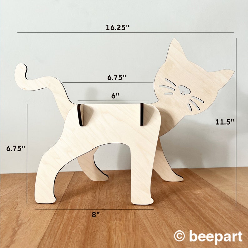 May include: Wooden cat-shaped shelf unit with a 15.2 cm wide shelf, measuring 41.3 cm tall, 29.2 cm wide, and 20.3 cm deep.