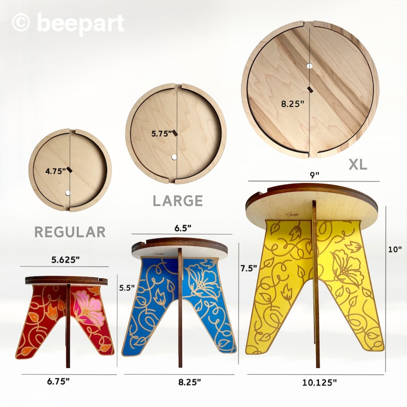 May include: Three wooden stools with different sizes and designs. The smallest stool is 6.75 inches wide and has a red and pink floral design. The middle stool is 8.25 inches wide and has a blue and white floral design. The largest stool is 10.125 inches wide and has a yellow and white floral design. The stools are all made of wood and have a simple, elegant design.