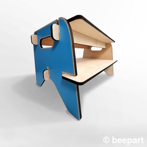 May include: A blue and natural wood step stool with two shelves. The top shelf is slightly wider than the bottom shelf. The stool is made of plywood and has a black edge.