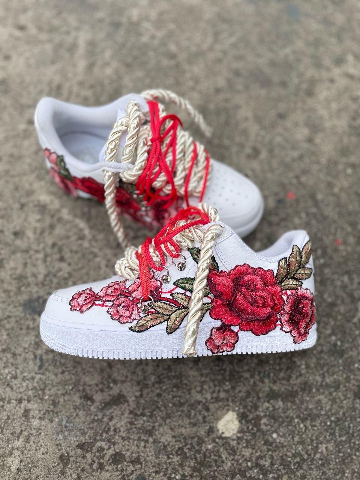 white and red air force 1 with rose