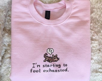 Stardew Valley Exhausted Cat Sweatshirt, Pixel Art, Cozy Gamer Gift, I’m starting to feel exhausted