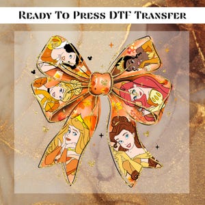 May include: A Ready To Press DTF Transfer featuring a large bow shape filled with an autumn-themed pattern. The design includes illustrations of six animated princesses, orange pumpkins, and fall leaves, accented with small gold glitter sparkles.