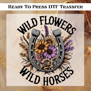 May include: A black and white illustration of a horseshoe with wild flowers and the text "Wild Flowers Wild Horses".