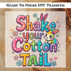 May include: A colorful iron-on transfer design featuring a cartoon bunny with a pink bow and the text "Shake your Cotton Tail".