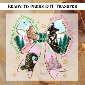 May include: A pink and green bow with glitter and snowflakes. The bow has two images inside, one of a witch and one of a princess. The text on the bow reads "Because I Knew You I Have Been Changed For Good".