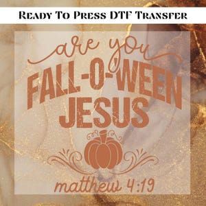 May include: A ready-to-press DTF transfer with the text "are you FALL-O-WEEN JESUS" in a rustic orange font, featuring a pumpkin graphic. The text "matthew 4:19" is at the bottom. The background has a marble effect.