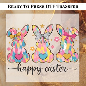May include: Three colorful Easter bunny silhouettes with bows and hearts, against a light brown background. The text "happy easter" is written below the bunnies.