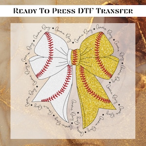 May include: A white and gold glitter bow with red stitching and the text "Game Day" repeated around the bow.