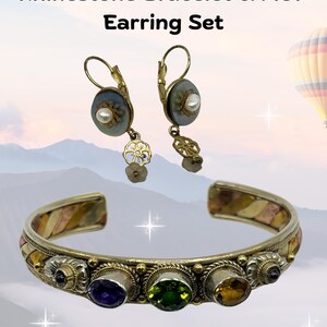 May include: Vintage multi-metal rhinestone bracelet and MOP earring set. The bracelet features a silver, gold, and copper band with colorful gemstones. The earrings have a pearl and floral design. Text on the image reads: "Vintage Multi-Metal Rhinestone Bracelet & MOP Earring Set."