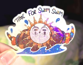 May include: Holographic sticker with a cartoon sun character in a sea of blue waves. The sticker has the text "TIME FOR SWIM SWIM" in a playful font. The sun has a smiling face and is surrounded by rays.