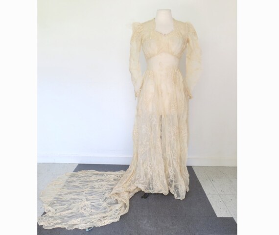 1940s wedding gown with long train and veil