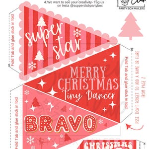 May include: Printable Christmas banner with red and pink pennants. The banner includes the phrases "Super Star", "Merry Christmas Tiny Dancer", "Bravo", and "Christmas Vibes". The design features snowflakes, stars, and Christmas trees.
