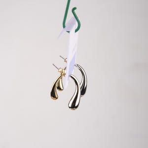 Gold And Silver Abstract Lava Earrings, Drip-Shaped Modern Hoops, Fluid Art-Inspired Design For Bold Women In Brass