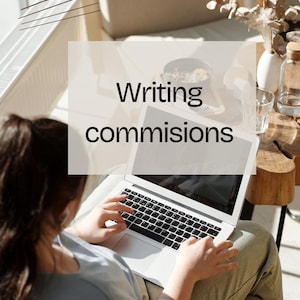 May include: A person using a silver laptop with the words "Writing commissions" overlaid on the image. The person is wearing a light blue shirt and sitting in a well-lit room. A small table with decorative items is in the background.