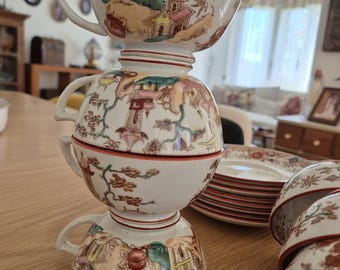 Undurchsichtige Sarreguemines-Teetassen und Untertassen aus Kyoto