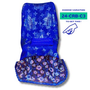 May include: A blue and silver saree with a floral design. The saree has a scalloped edge and is decorated with sequins. The text "24-CRB-C3" is visible in the image.