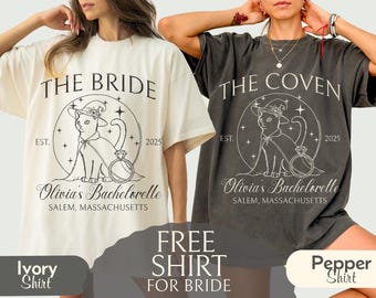 May include: Ivory and pepper-colored t-shirts with the text "THE BRIDE" and "THE COVEN" respectively. Each shirt features a cat wearing a witch hat and cape, with the text "Olivia's Bachelorette, Salem, Massachusetts" and the year "2025".