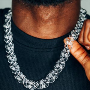 May include: A clear plastic chain necklace with a chunky link design.