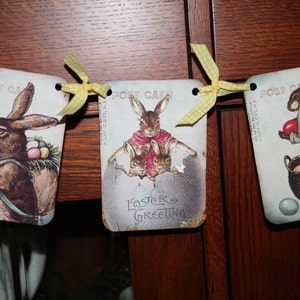 May include: Three vintage Easter cards with yellow ribbon and bunny illustrations. The cards read "Post Card" and "Easter Greeting".