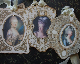 6 Marie Antoinette tags, hand cut framed with rhinestones.