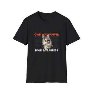 May include: Black t-shirt with a wolf graphic and the text "OWN YOUR POWER" in orange and "BOLD & FEARLESS" in white.