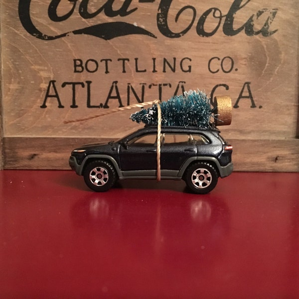 Jeep Cherokee Carrying Christmas Tree Ornament