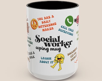 May include: A white ceramic mug with a black interior, featuring the text "Social Worker coping mug." The mug is decorated with various phrases and cartoon graphics, including "You are a daily difference maker" and "Laugh about it."