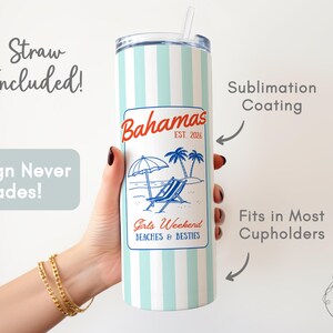 May include: A white and light blue striped tumbler with a straw, featuring a "Bahamas" design with a beach scene. The tumbler includes the text "Girls Weekend Beaches & Besties".