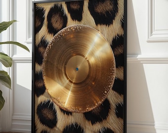 May include: A framed art print featuring a gold-colored vinyl record with a blue center, set against a leopard print background. The artwork is encased in a black frame, creating a striking contrast.