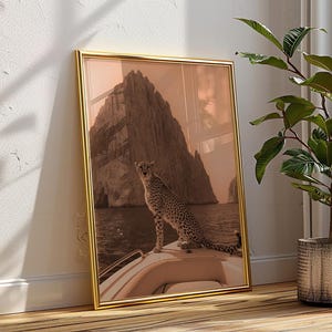 May include: A framed print of a cheetah sitting on a boat in front of a large rock formation. The cheetah is looking to the left of the image. The background is a light brown colour.