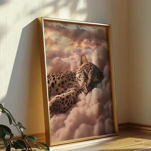 May include: A framed print of a leopard sleeping on a cloud with a sunset in the background.