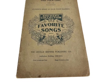 May include: A vintage sheet music book, "Brewer's Collection of Favorite Songs." The cover is a faded tan colour with black text and decorative elements. The title is in a large, decorative font. Published by The Orville Brewer Publishing Co.