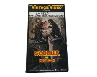 Godzilla Vs Megalon VHS 1976 sin código de barras VV-471 Amvest Video Vintage Video 1985, Monster Movie Monsters Classic Monsters Video Tape Old Movie