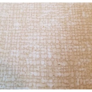 May include: Close-up of a beige textured surface with a pattern of small white circles.