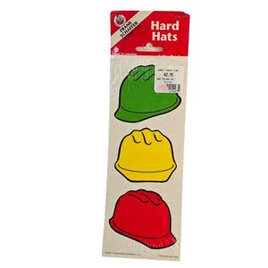 May include: A package of Frank Schaffer Hard Hats stickers. The stickers feature three hard hat designs in green, yellow, and red. The packaging includes the Frank Schaffer logo and the text "Hard Hats".