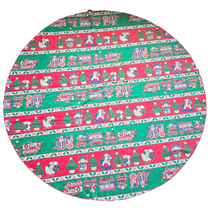 May include: A round Christmas tree skirt with a festive pattern. The skirt features alternating red and green stripes adorned with Christmas trees, toy trains, teddy bears, and rocking horses. The skirt is made of fabric and has a red border.