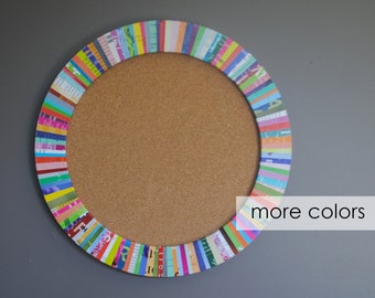 small 12” dia cork board-made from recycled magazines,colorful,strips,blue, green,red,purple, pink, yellow, orange,message board, round