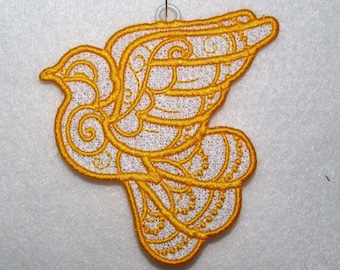 May include: A yellow embroidered dove with a white outline, ideal for a festive ornament or craft project.