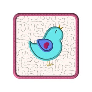 May include: A square patch featuring a light blue bird with a red heart on its wing and a yellow crown. The background is off-white with a stitched pattern, and the patch is framed with a pink border.