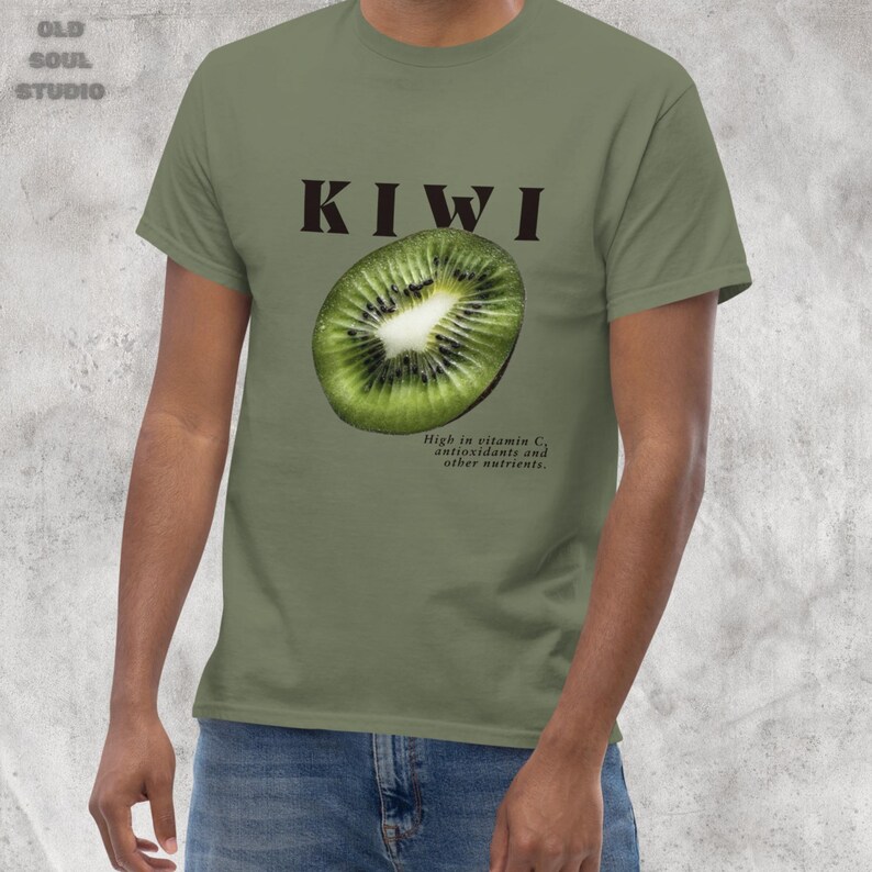 Green Y2K aesthetic unisex t-shirt featuring a bold KIWI text, a vibrant kiwi graphic, and small retro-inspired text below. A tropical, playful vibe perfect for casual, streetwear looks