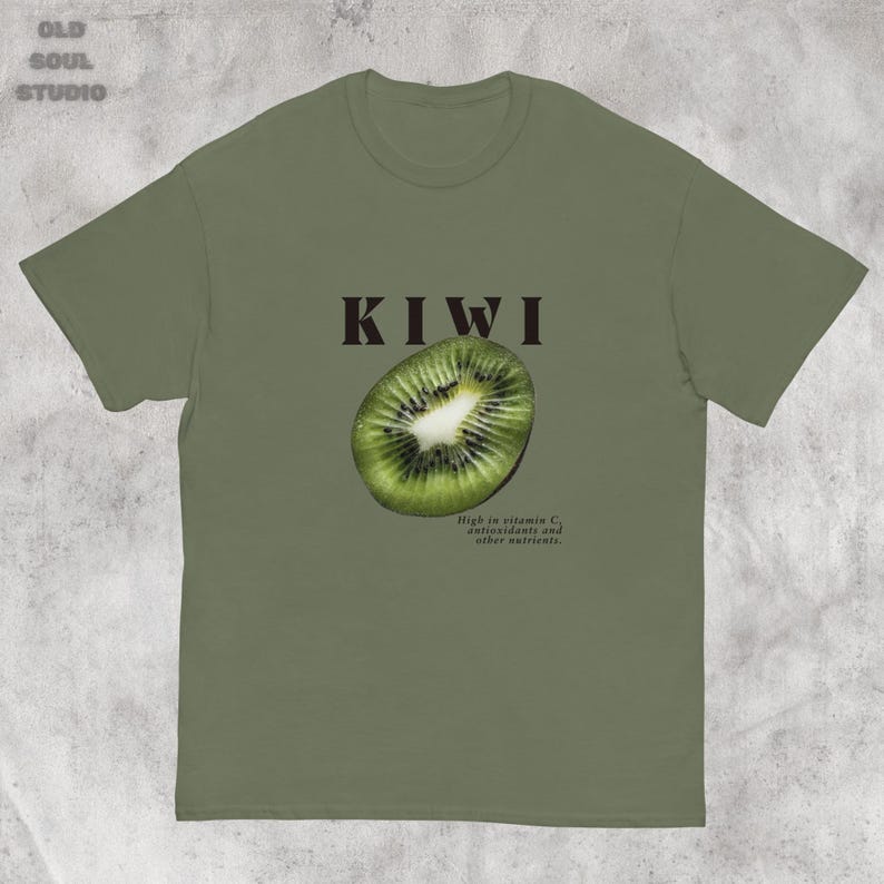 Green Y2K aesthetic unisex t-shirt featuring a bold KIWI text, a vibrant kiwi graphic, and small retro-inspired text below. A tropical, playful vibe perfect for casual, streetwear looks