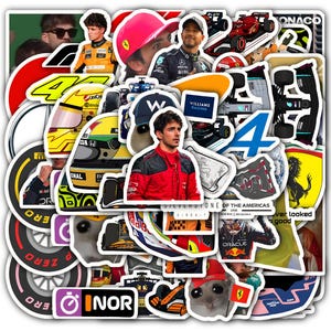 May include: A collection of die-cut stickers featuring Formula 1 racing themes. The stickers showcase drivers, helmets, cars, and logos. Colors include red, yellow, black, white, and blue. Some stickers have text, including "SILVERSTONE OF THE AMERICAS" and "ORACLE".