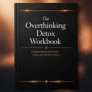 May include: A hardcover book titled "The Overthinking Detox Workbook" with gold accents. The cover is black with white text and the subtitle "A Guided Journal for Clarity, Calm, and Mental Freedom".