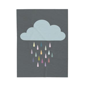 May include: A gray blanket with a light blue cloud and colorful raindrops in shades of yellow, teal, orange, pink, and purple. The blanket has a simple, whimsical design, perfect for a nursery or child's room.