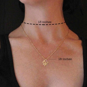 Model with 13 inch neck wearing 18 inch lotus flower necklace with tiny pink tourmaline accent charm.