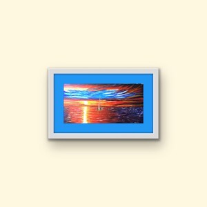 May include: A framed painting depicting a sailboat on the water at sunset. The sky is a mixture of orange, red, and purple with clouds. The water is a deep blue with a reflection of the sunset.