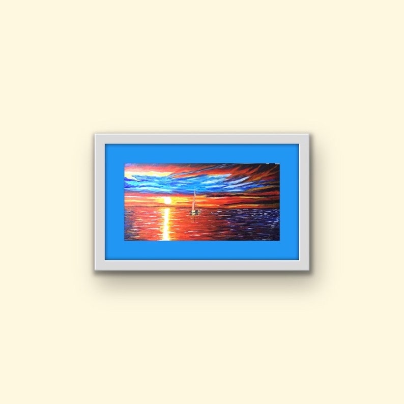 May include: A framed painting depicting a sailboat on the water at sunset. The sky is a mixture of orange, red, and purple with clouds. The water is a deep blue with a reflection of the sunset.