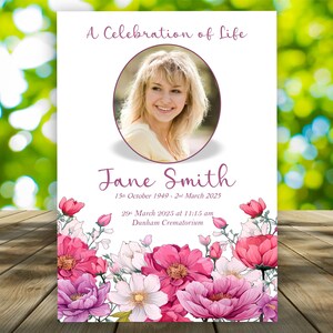 May include: A memorial card featuring a woman's photo, the words "A Celebration of Life", and the name "Jane Smith" with dates. The bottom is decorated with pink, purple, and white floral illustrations.
