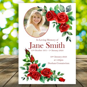 May include: A white memorial card featuring a portrait of a woman, framed by red roses and green foliage. Text includes "In Loving Memory of Jane Smith", dates, and a crematorium location.